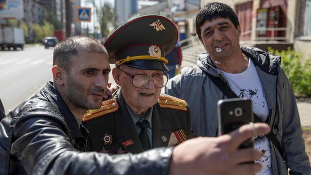 The Wider Image: Russian WW2 veteran, 100, calls for peace on Victory Day