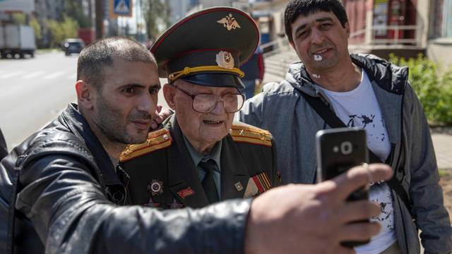 The Wider Image: Russian WW2 veteran, 100, calls for peace on Victory Day