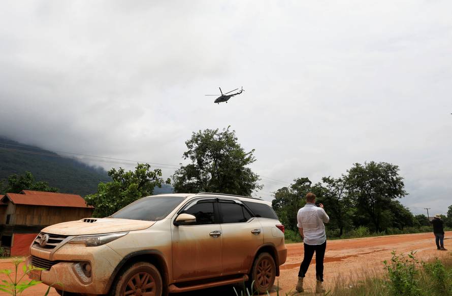 A military helicopter flies near flooded areas after the Xepian-Xe Nam Noy hydropower dam collapsed in Attapeu province