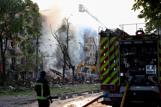 Site of an apartment building damaged during a Russian missile and drone strike, amid Russia's attack on Ukraine, in Kyiv