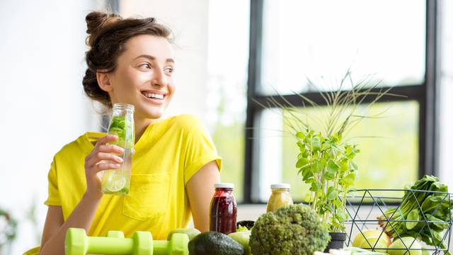 Woman with healthy food indoors