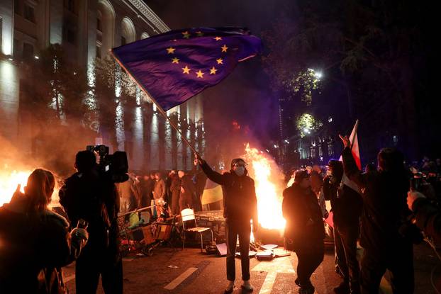 Supporters of Georgia's opposition attend a rally to protest, after government halts EU application until 2028, in Tbilisi