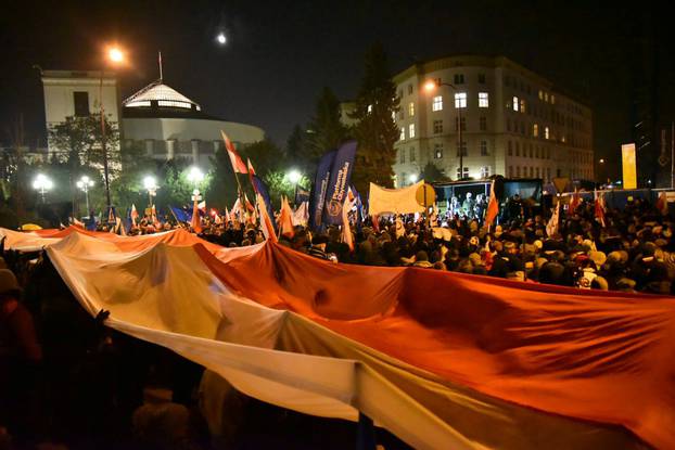 People demonstrate against new restrictions for media at the Polish Parliament in front of the Parliament building in Warsaw,