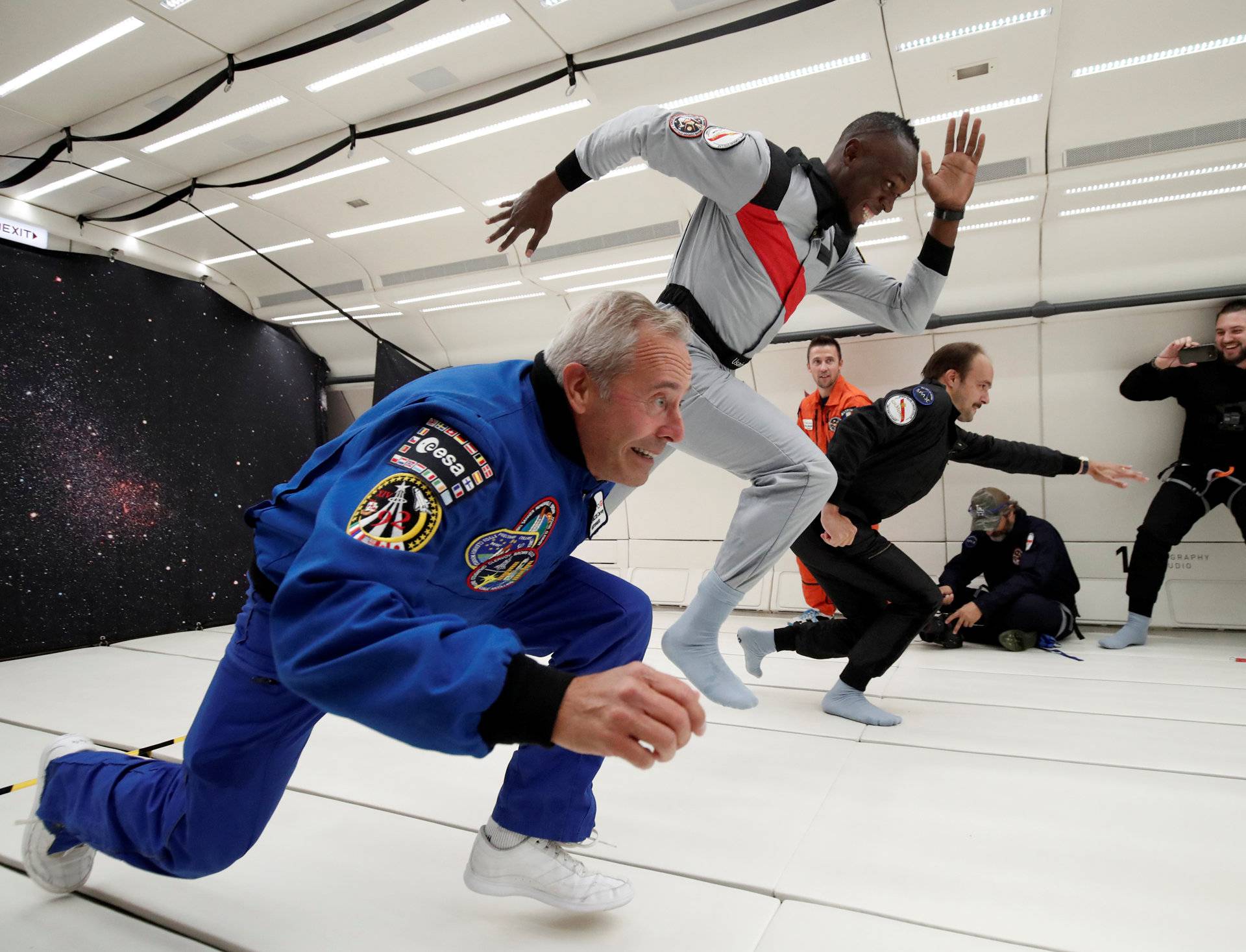Retired sprinter Usain Bolt, French astronaut Jean-Francois Clervoy and French Interior designer Octave de Gaulle enjoy zero gravity conditions during a flight in a specially modified plane above Reims