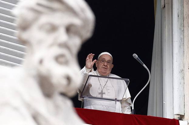 Pope Francis leads the Angelus prayer from his window at the Vatican