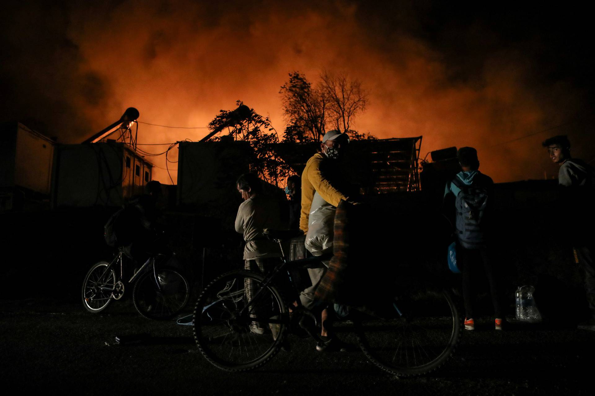 Fire burns at the Moria camp for refugees and migrants on the island of Lesbos