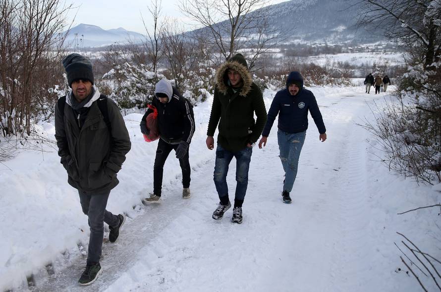 A group of migrants attempts to illegally cross the border into Croatia on the Pljesevica Mountain near Bihac