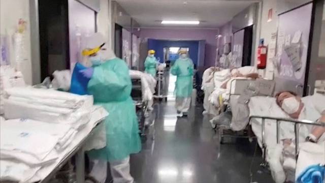 General view of a corridor with patients and medical personnel at an emergency unit of a Spanish hospital in Getafe, outside Madrid