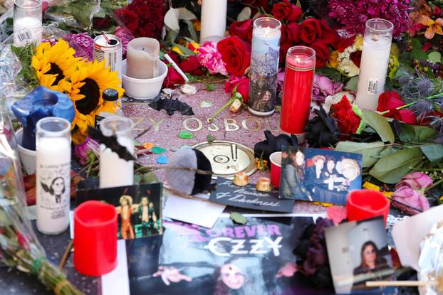 Flowers and pictures are placed on the star of late Ozzy Osbourne at the Hollywood Walk of Fame in Los Angeles