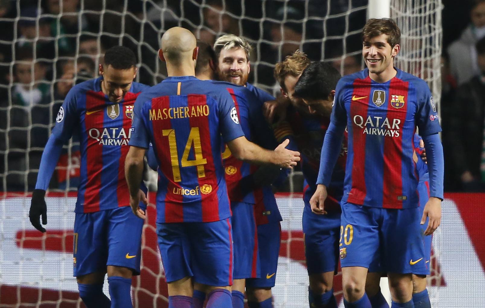 Barcelona's Lionel Messi celebrates scoring their second goal with team mates