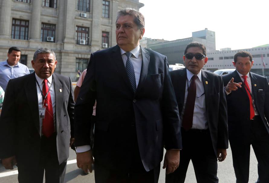 FILE PHOTO: Former Peruvian president Alan Garcia talks to the media as he arrives at the National Prosecution office in Lima