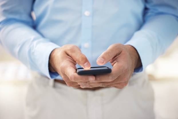 Id love to hear more about this. and the Businessman Cling His Smartphone to Sond a Text Message.