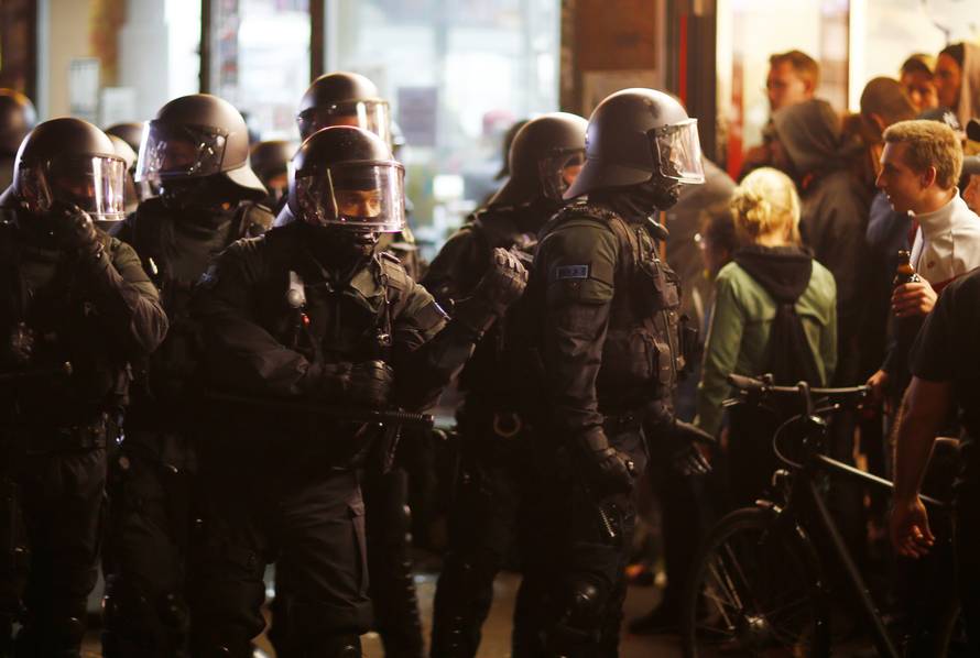 German riot police stand guard during the demonstration at the G20 summit in Hamburg