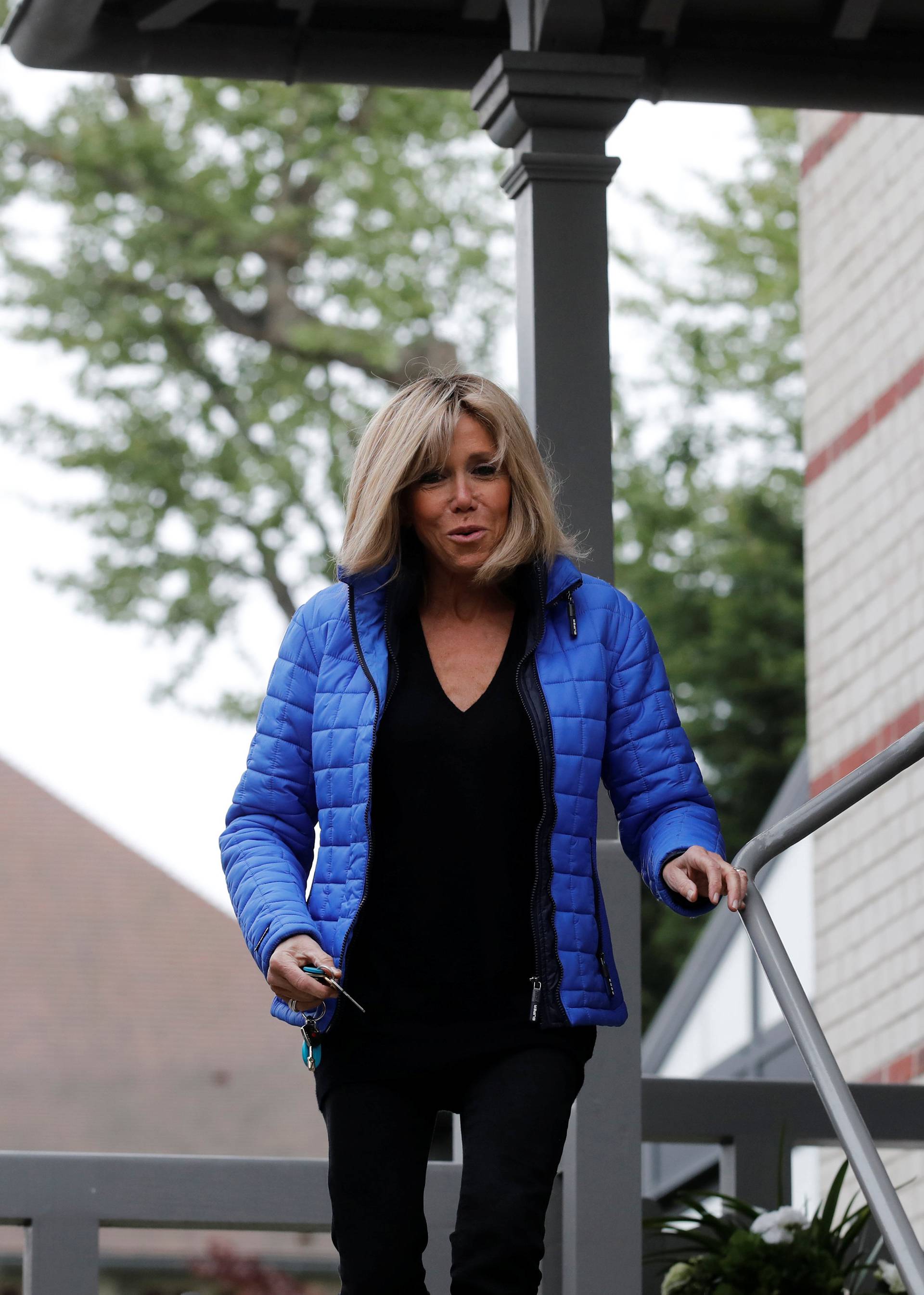 Brigitte Trogneux, wife of French presidential candidate Emmanuel Macron, speaks with media outside her house in Le Touquet, France