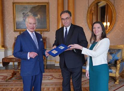 King Charles is presented with the first bank notes featuring his portrait in London