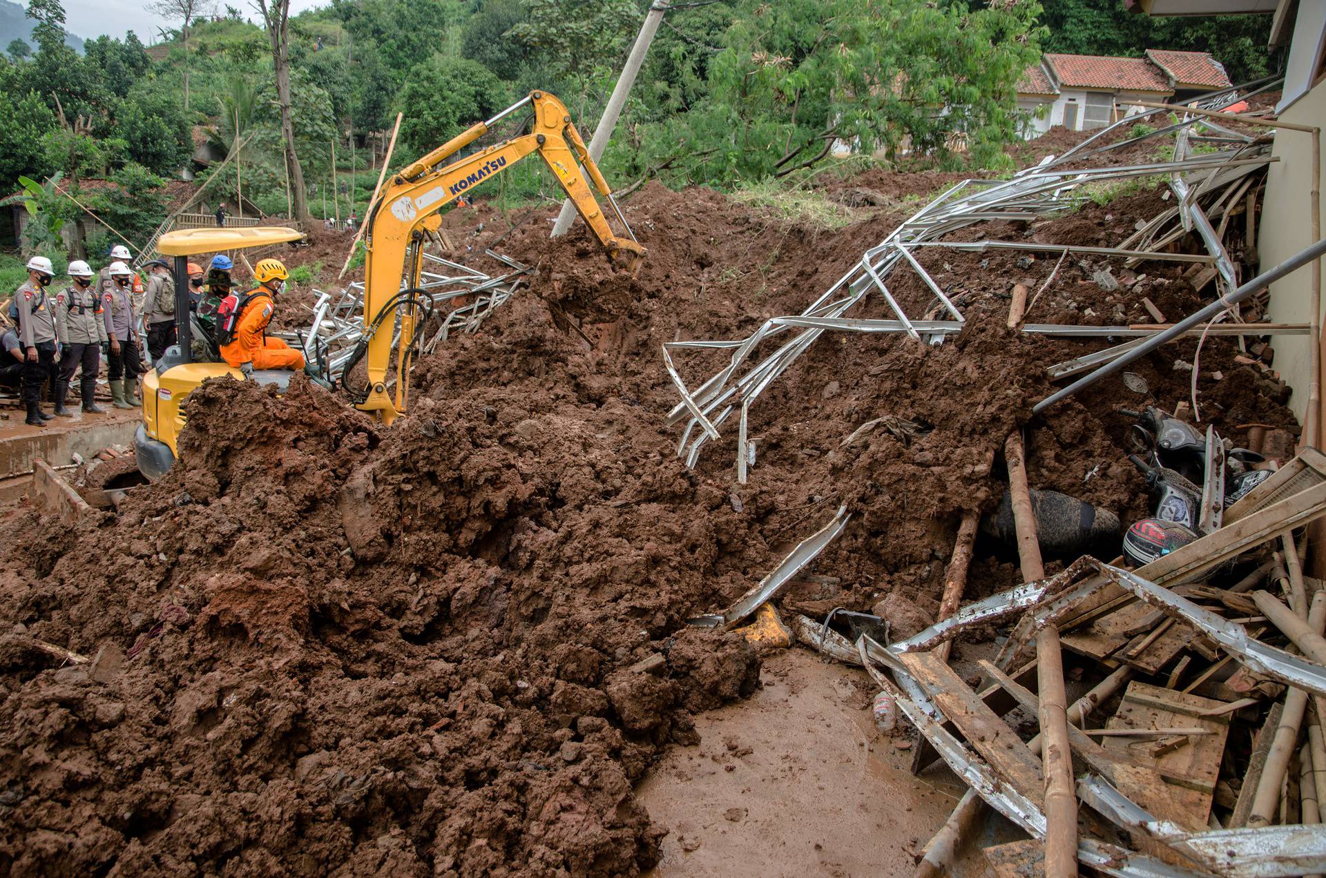 Indonesian rescuers attempt the search for victims buried by landslides in Sumedang