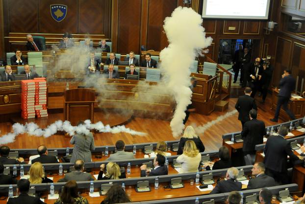 Kosovo opposition politicians release tear gas in parliament to obstruct a session in Pristina