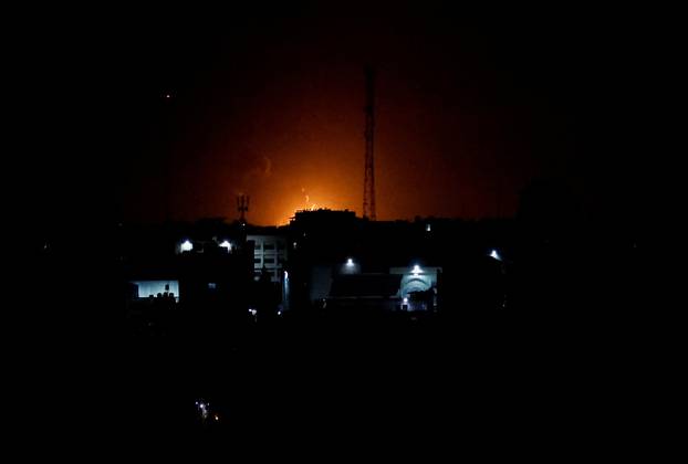 Smoke and flames rise during Israeli airstrikes in Gaza City