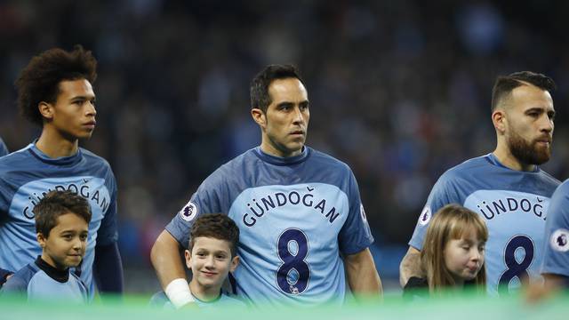 Manchester City's Claudio Bravo wears a shirt in support of injured team mate Ilkay Gundogan before the match