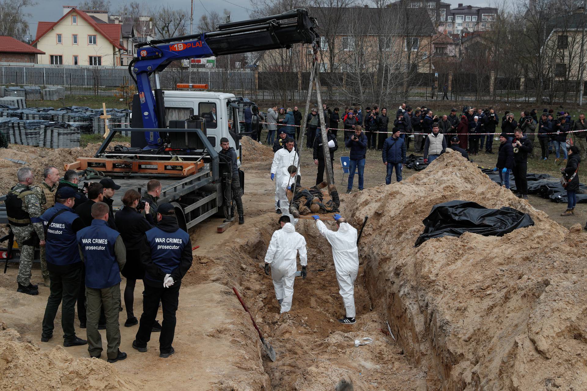 Exhumation of bodies of civilians from a mass grave in Bucha