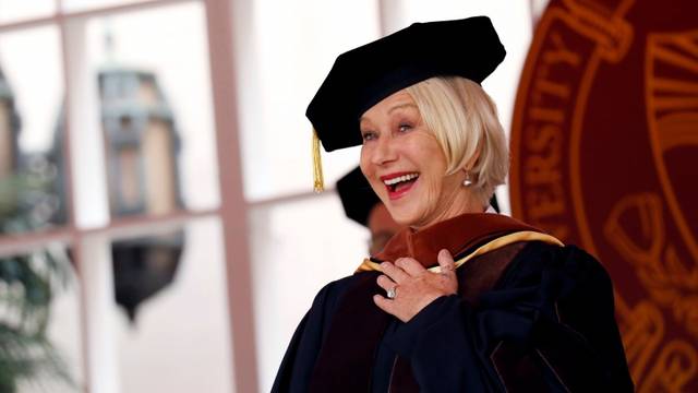 Actor Helen Mirren receives an honorary degree from USC President C. L. Max Nikias during the commencement ceremony at the University of Southern California (USC) in Los Angeles