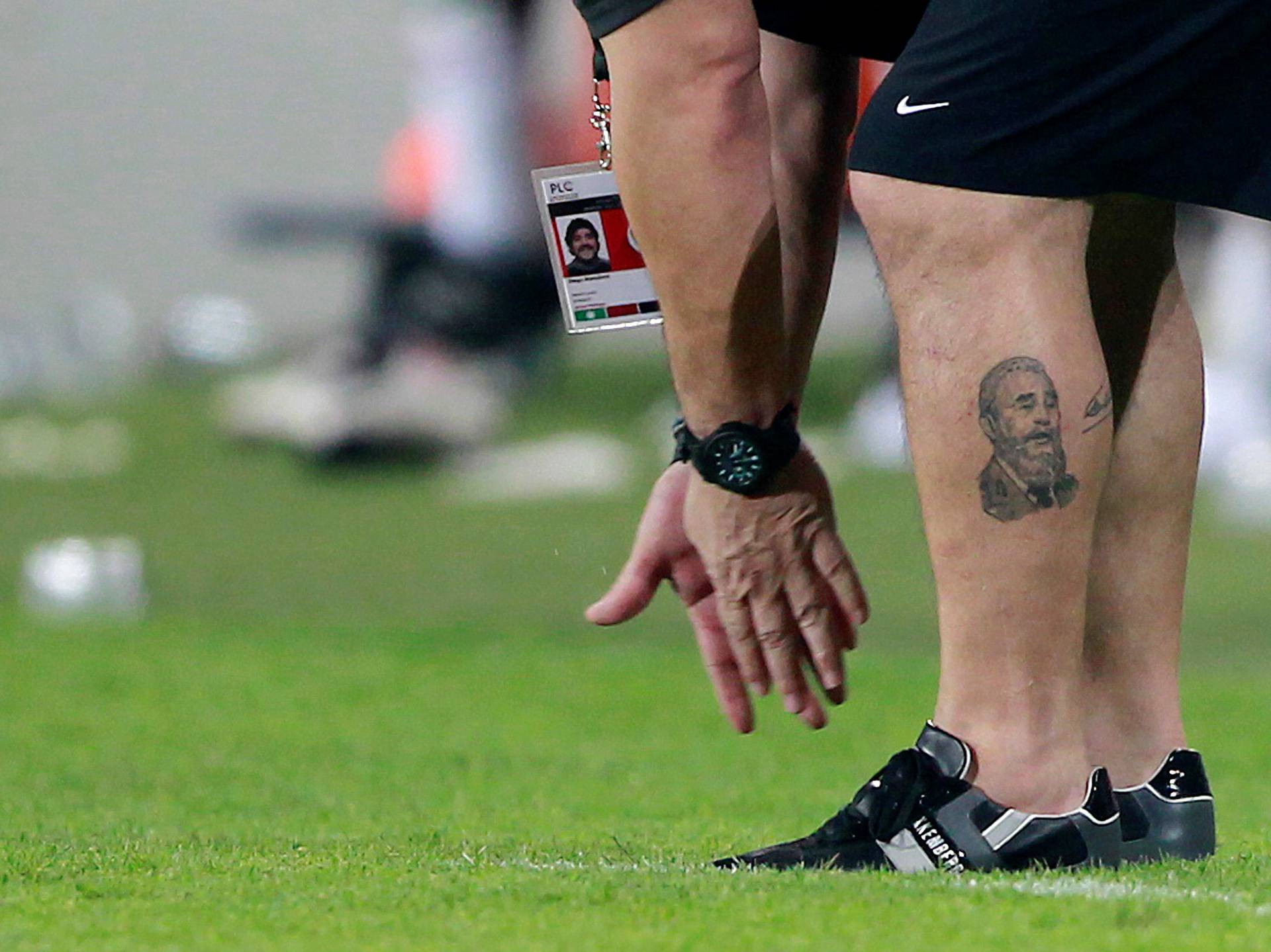 FILE PHOTO: A tattoo of Cuba's former President Fidel Castro is seen on the leg of Al Wasl's head coach Diego Maradona of Argentina as he reacts during their Pro-League soccer match against Al Jazira at Mohammad bin Zayed stadium in Abu Dhabi,