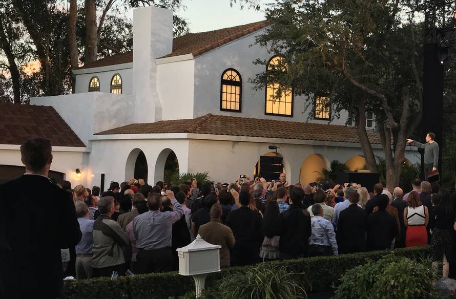 Tesla's electric car, Powerwall and solar roof are shown at an unveiling of new energy products aimed at illustrating the benefits of combining his electric car and battery maker with solar installer SolarCity Corp, in Los Angeles