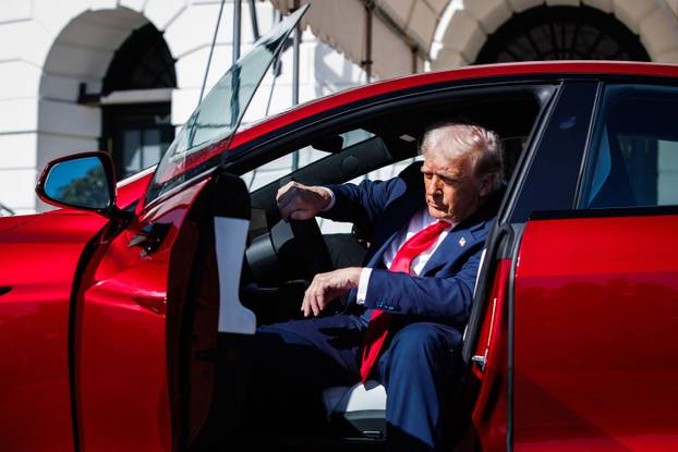 Trump views Tesla Vehicles on the South Lawn Driveway of The White House