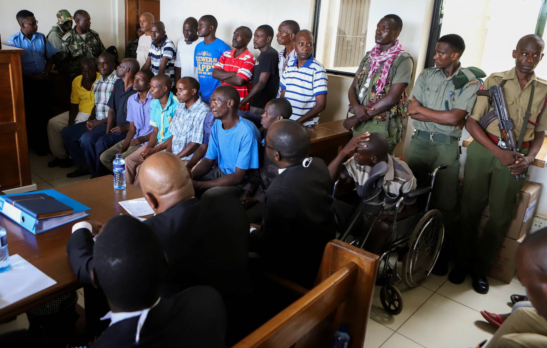 Paul Mackenzie, a Kenyan cult leader accused of ordering his followers, who were members of the Good News International Church, to starve themselves to death in Shakahola forest, stands in the dock at the Malindi Law Courts