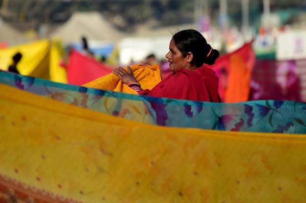 Devotees take a dip at Sangam during "Maha Kumbh Mela" in Prayagraj