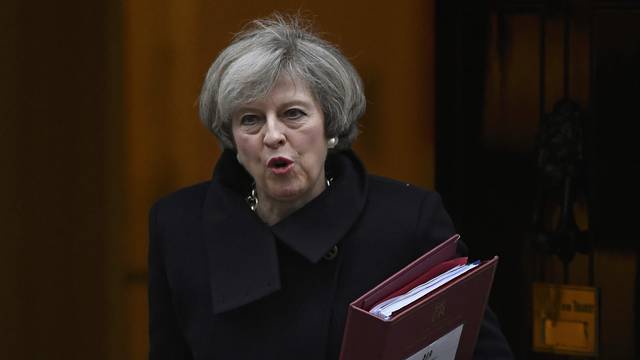 Britain's Prime Minister Theresa May leaves Number 10 Downing Street to attend Prime Minister's Questions at parliament in London