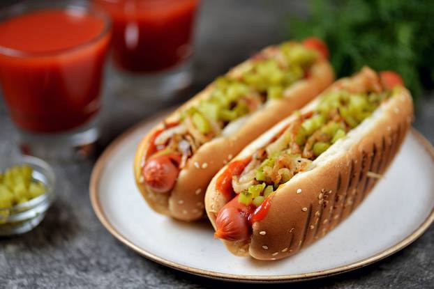 Homemade,Hot,Dogs,With,Fried,Onions,,Pickled,Cucumbers,Tomato,Sauce