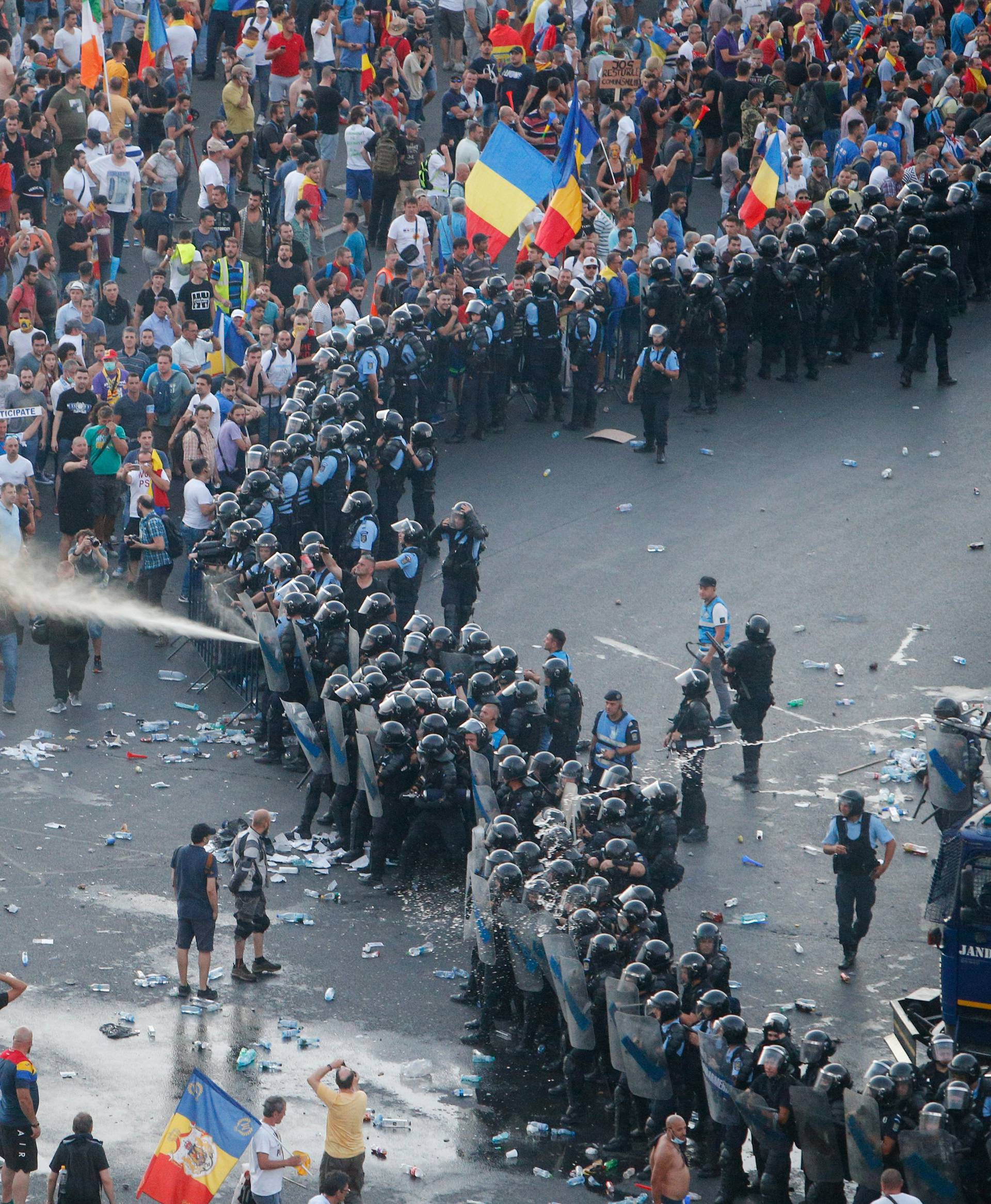 Police use pepper spray during a demonstration in Bucharest