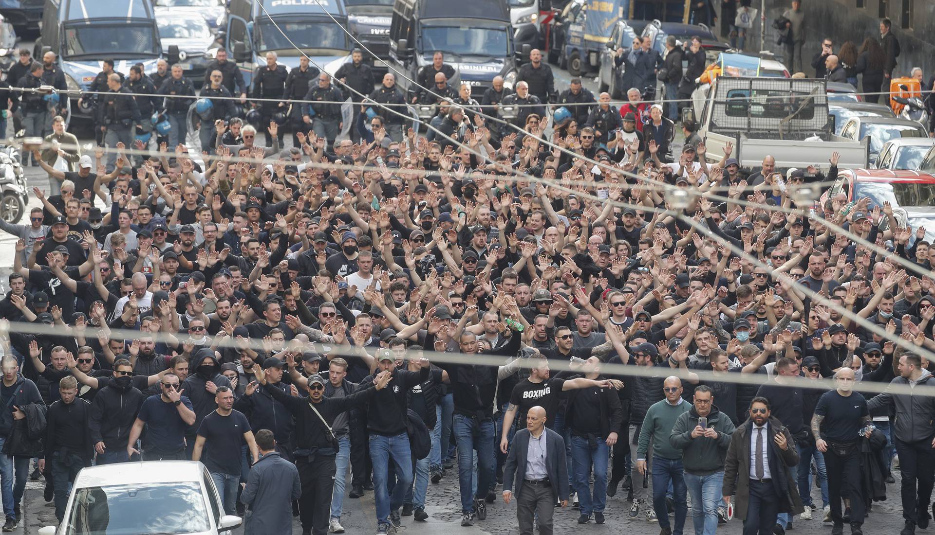 Italian police follow Eintracht Frankfurt fans walking through the streets of the city of Naples before the UEFA Champions League round of 16 return match between SSC Napoli and Eintracht Frankfurt.