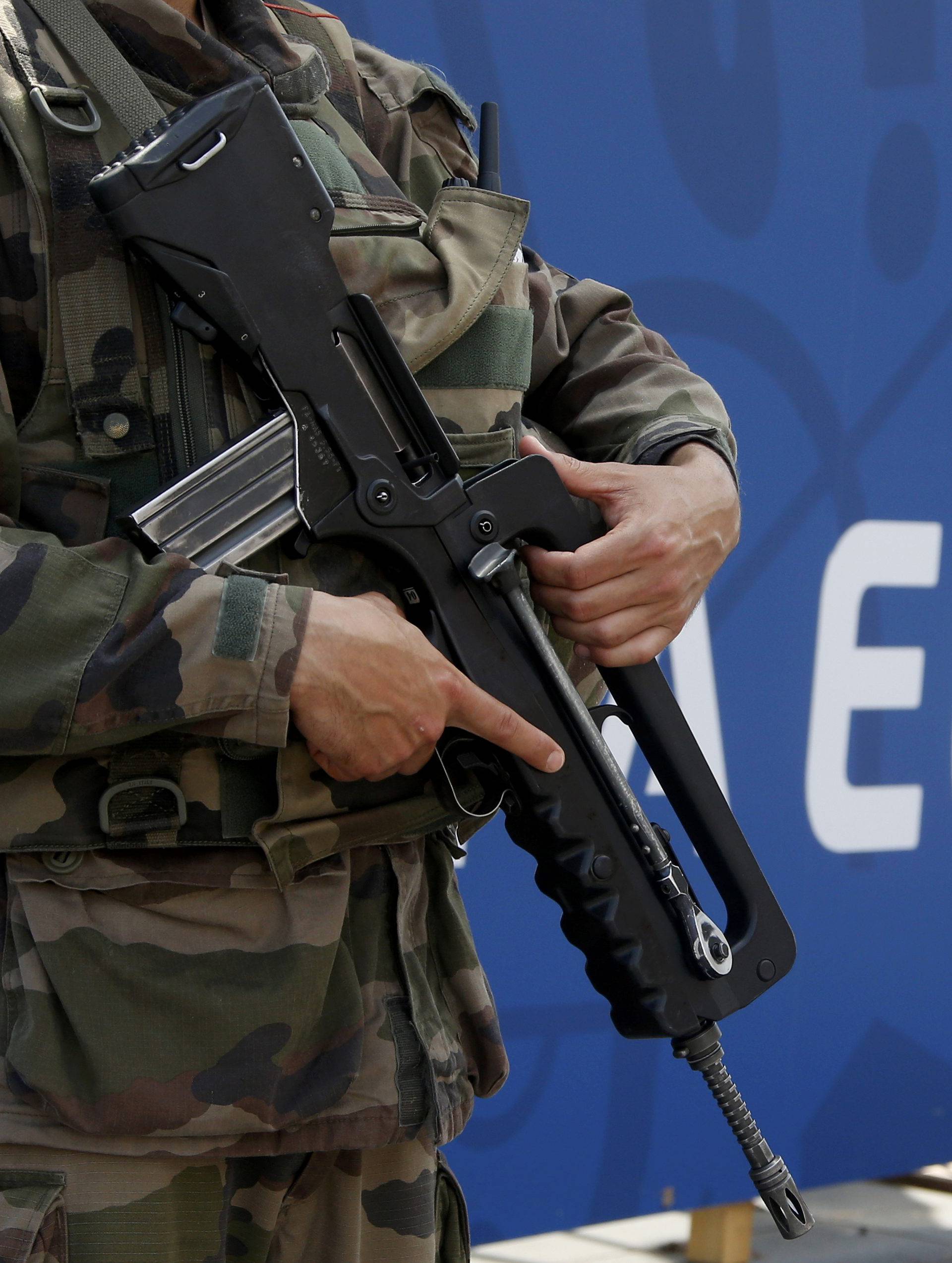 A soldier patrols outside a fan zone ahead of the UEFA 2016 European Championship in Nice