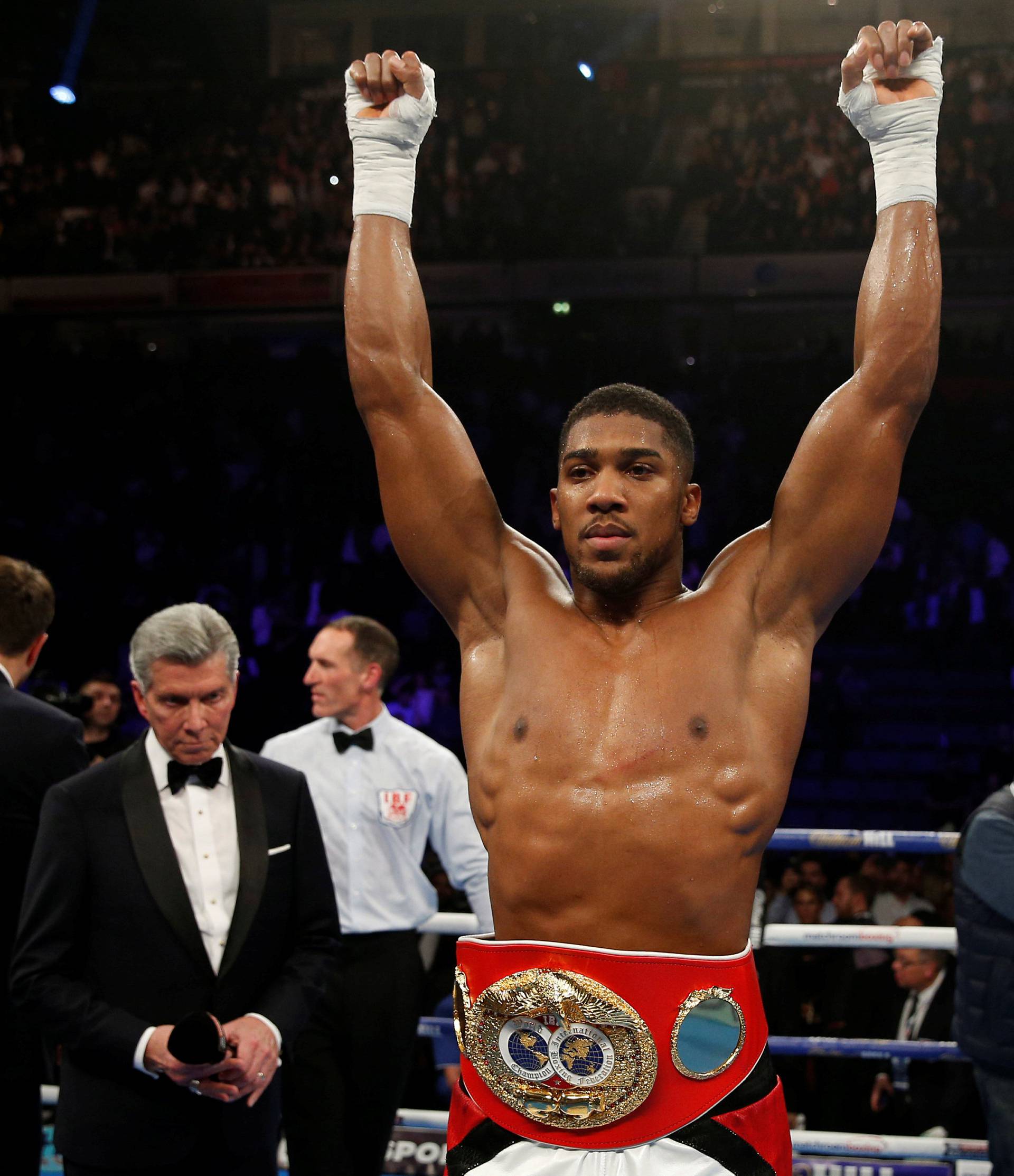 Anthony Joshua celebrates his win