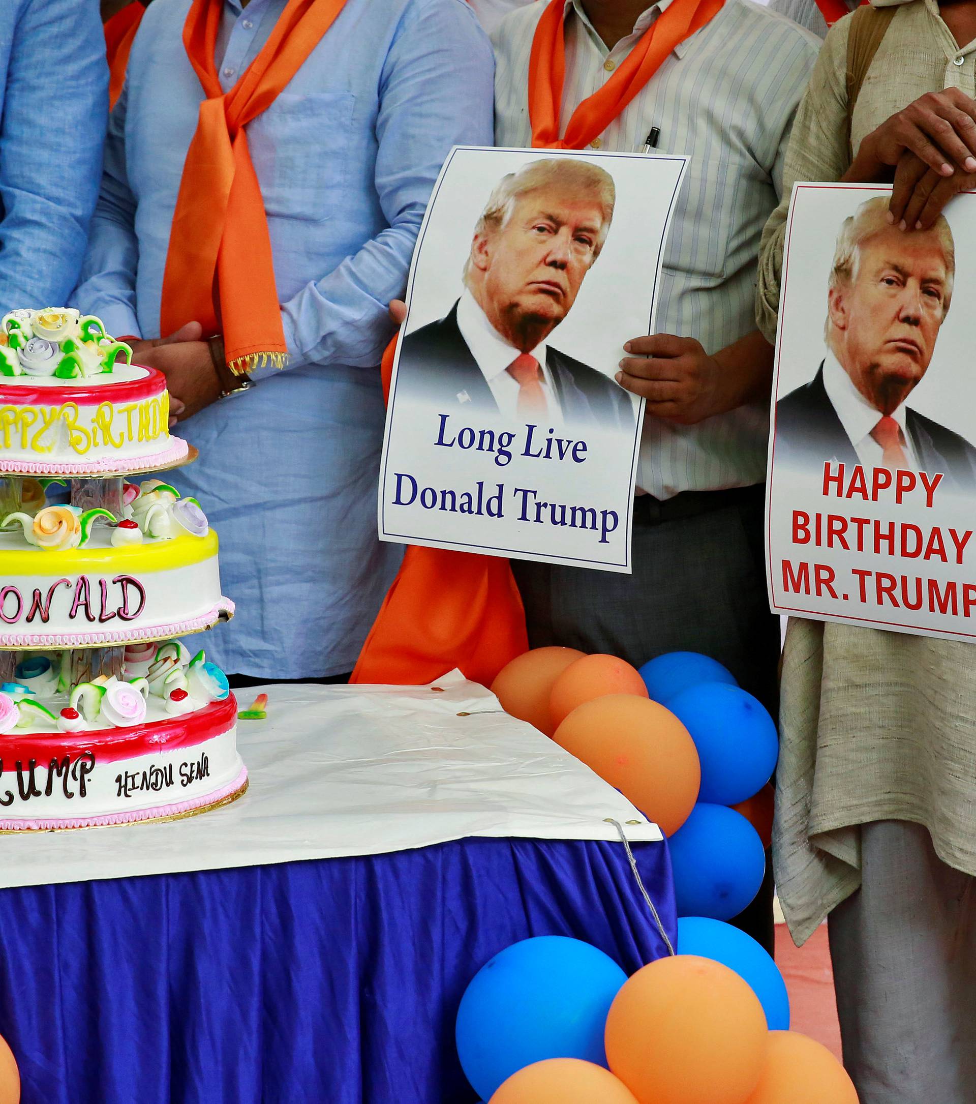 Members of Hindu Sena, a right wing Hindu group, celebrate U.S. Republican presidential candidate Trump's birthday in New Delhi