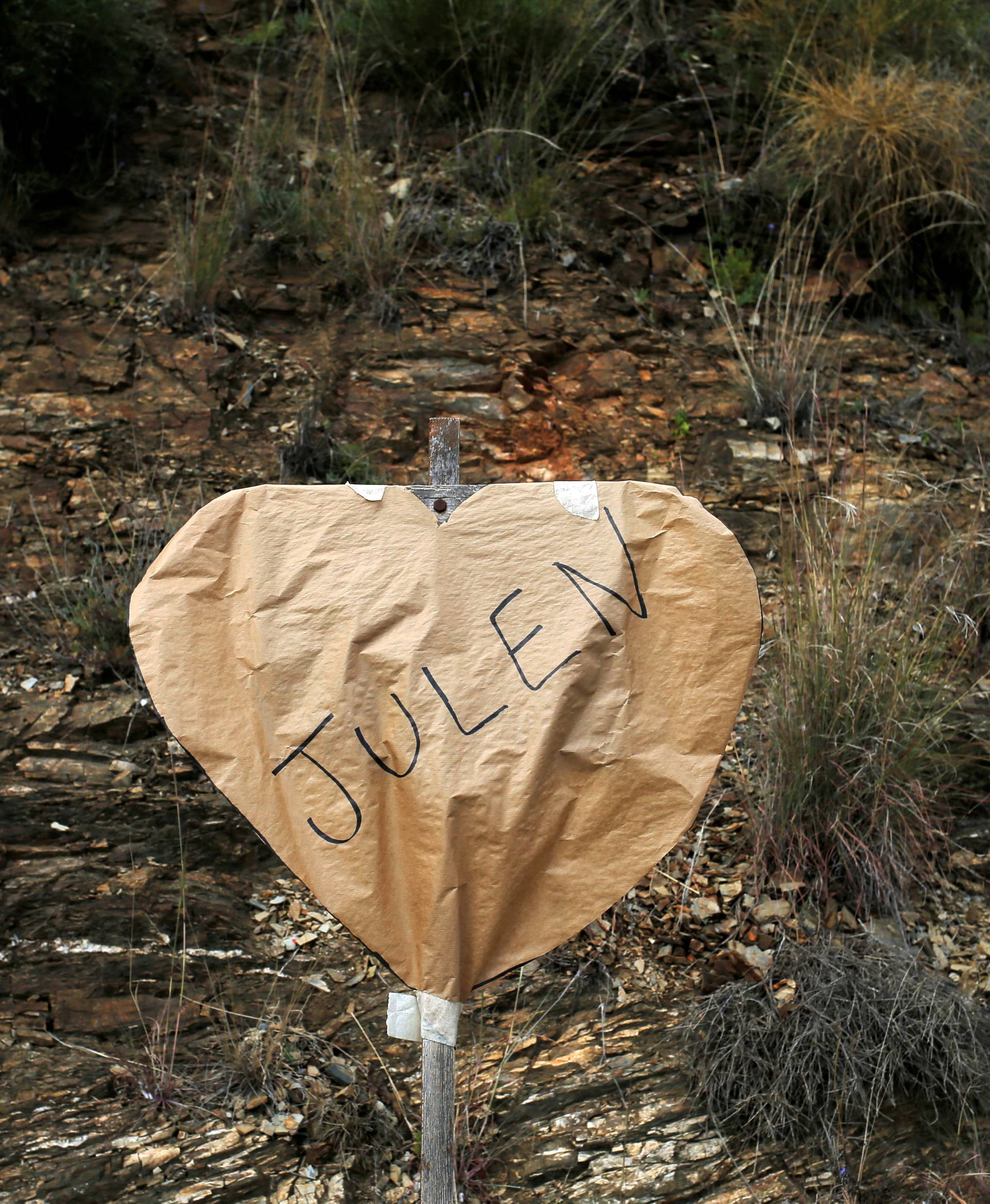 A banner in the shape of a heart is seen at the area where Julen, a Spanish two-year-old boy fell into a deep well seven days ago when the family was taking a stroll through a private estate, in Totalan