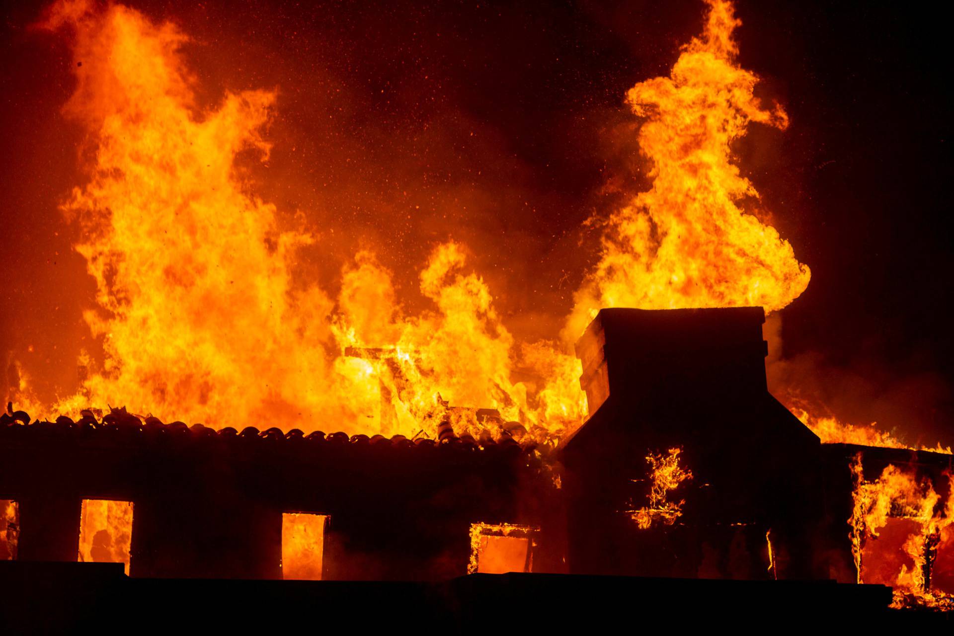 Palisades fire burns during a windstorm on the west side of Los Angeles