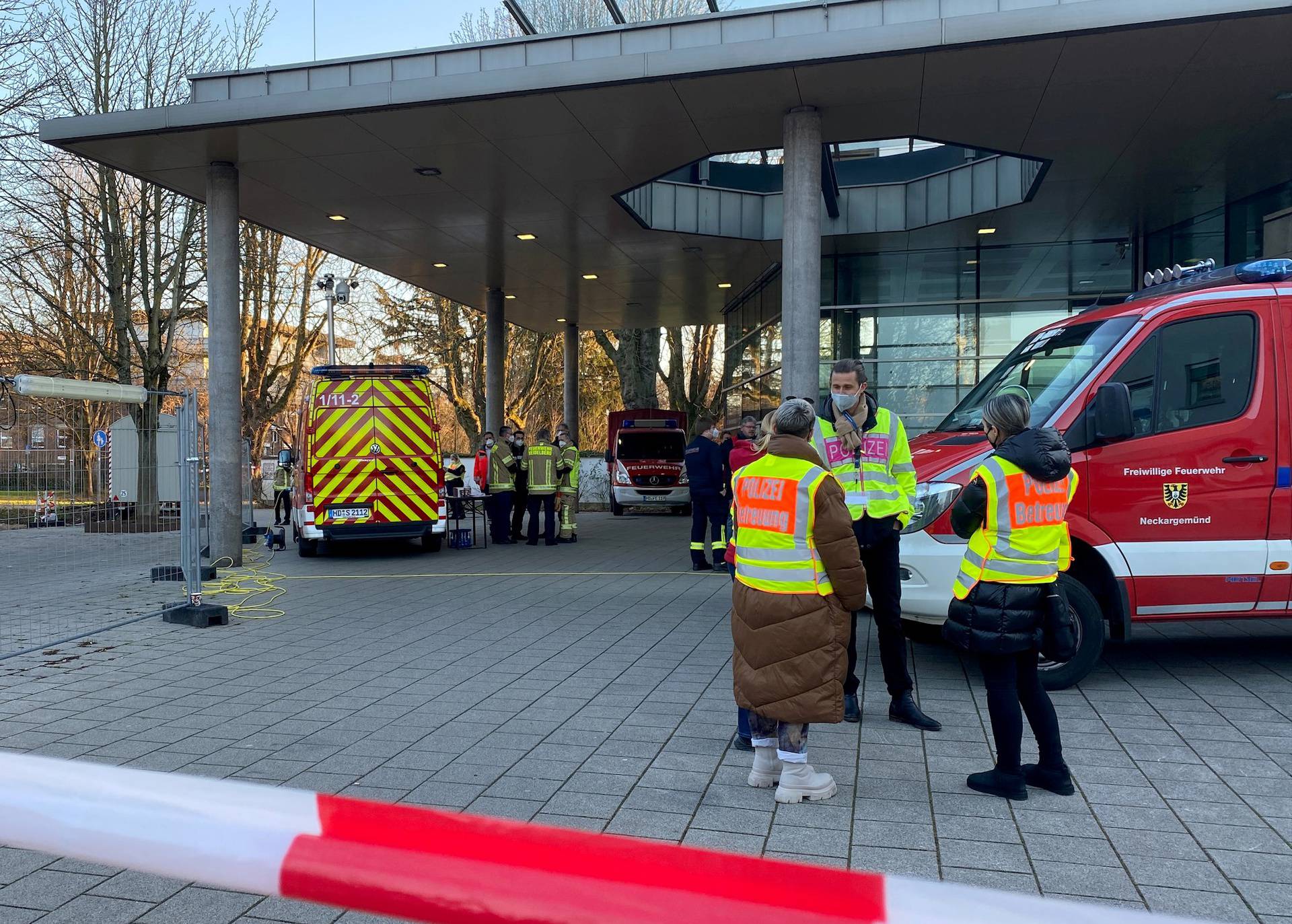 Police and firefighters secure the area at the premises of the Heidelberg university
