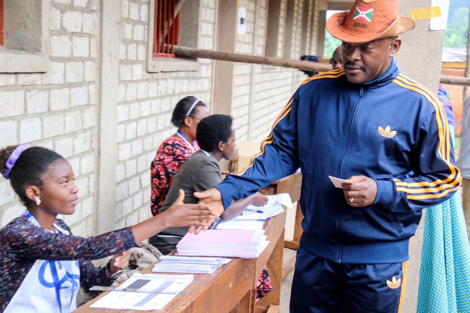 FILE PHOTO: Burundi President Pierre Nkurunziza is registered by an electoral official before casting his ballot at a polling centre during the constitutional amendment referendum at School Ecofo de Buye in Mwumba commune in Ngozi province