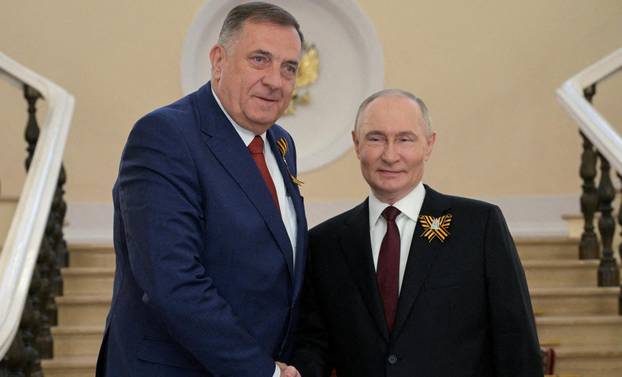 FILE PHOTO: Russian President Putin greets foreign leaders before parade marking WW2 victory anniversary in Moscow