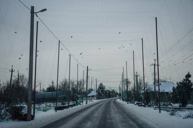 Anti-drone net installed over a street in Kramatorsk