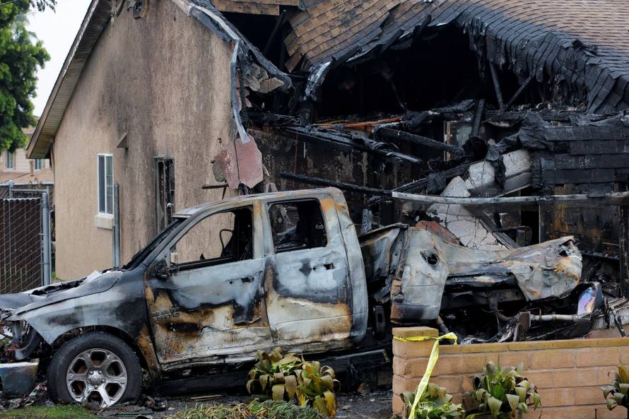 Crash scene after a civilian aircraft went down in a neighborhood, in San Diego