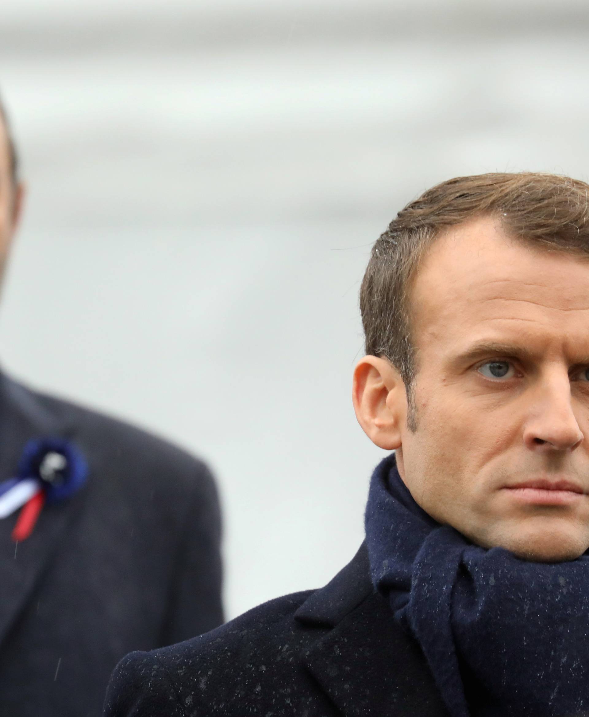 French President Emmanuel Macron and French Prime Minister Edouard Philippe attend a commemoration ceremony for Armistice Day, 100 years after the end of the First World War, at the Arc de Triomphe, in Paris