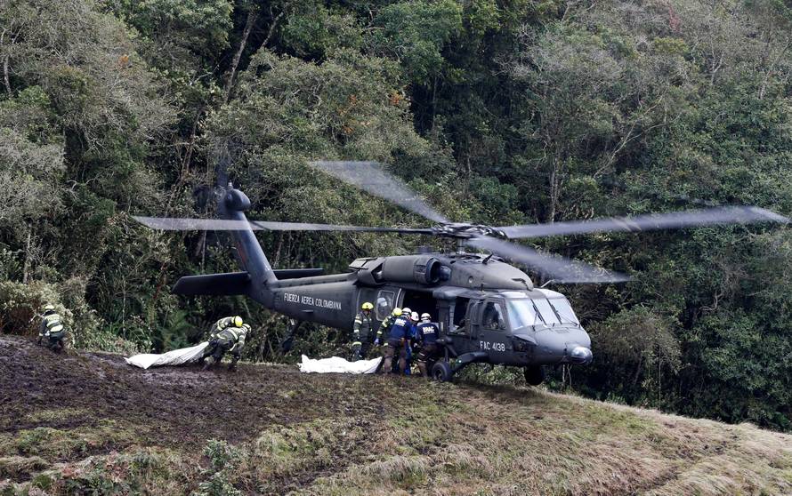 A Colombian air force helicopter arrives to retrieve the bodies of victims from the wreckage of a plane that crashed into the Colombian jungle with Brazilian soccer team Chapecoense onboard, near Medellin