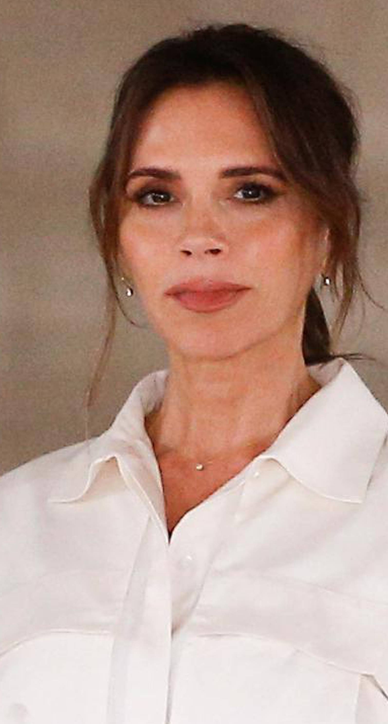 Designer Victoria Beckham at the end of her catwalk show during London Fashion Week in London