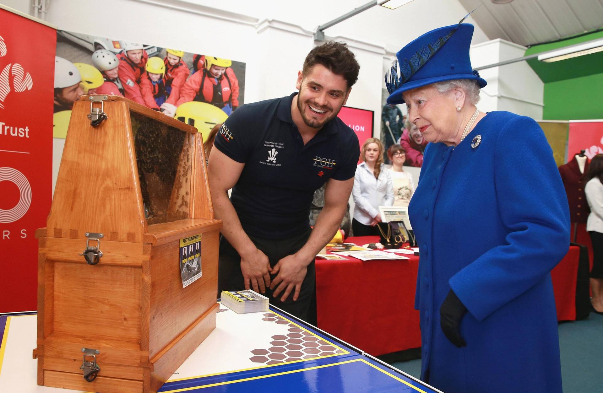 Queen Elizabeth II is shown the Queen Bee in a swarm of 30,000 by Peter Higgs of PGH Pest Control (a Prince's Trust Award Winner) during her visit to mark the 40th Anniversary of the Prince's Trust in Kennington