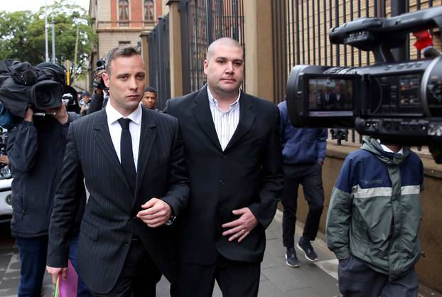 Former Paralympian Oscar Pistorius leaves during a court break at the Pretoria High Court