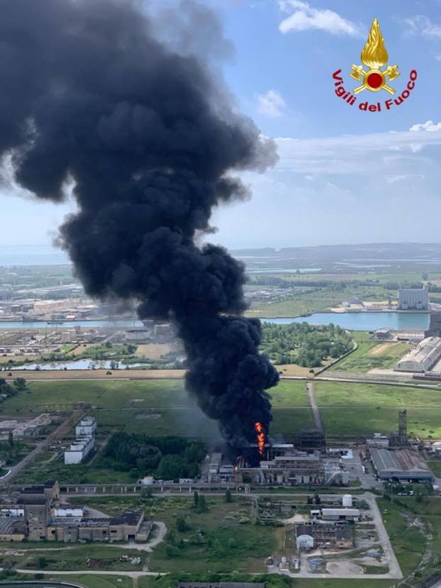 Large clouds of black smoke billow from a chemical plant after an explosion, in Marghera, near Venice